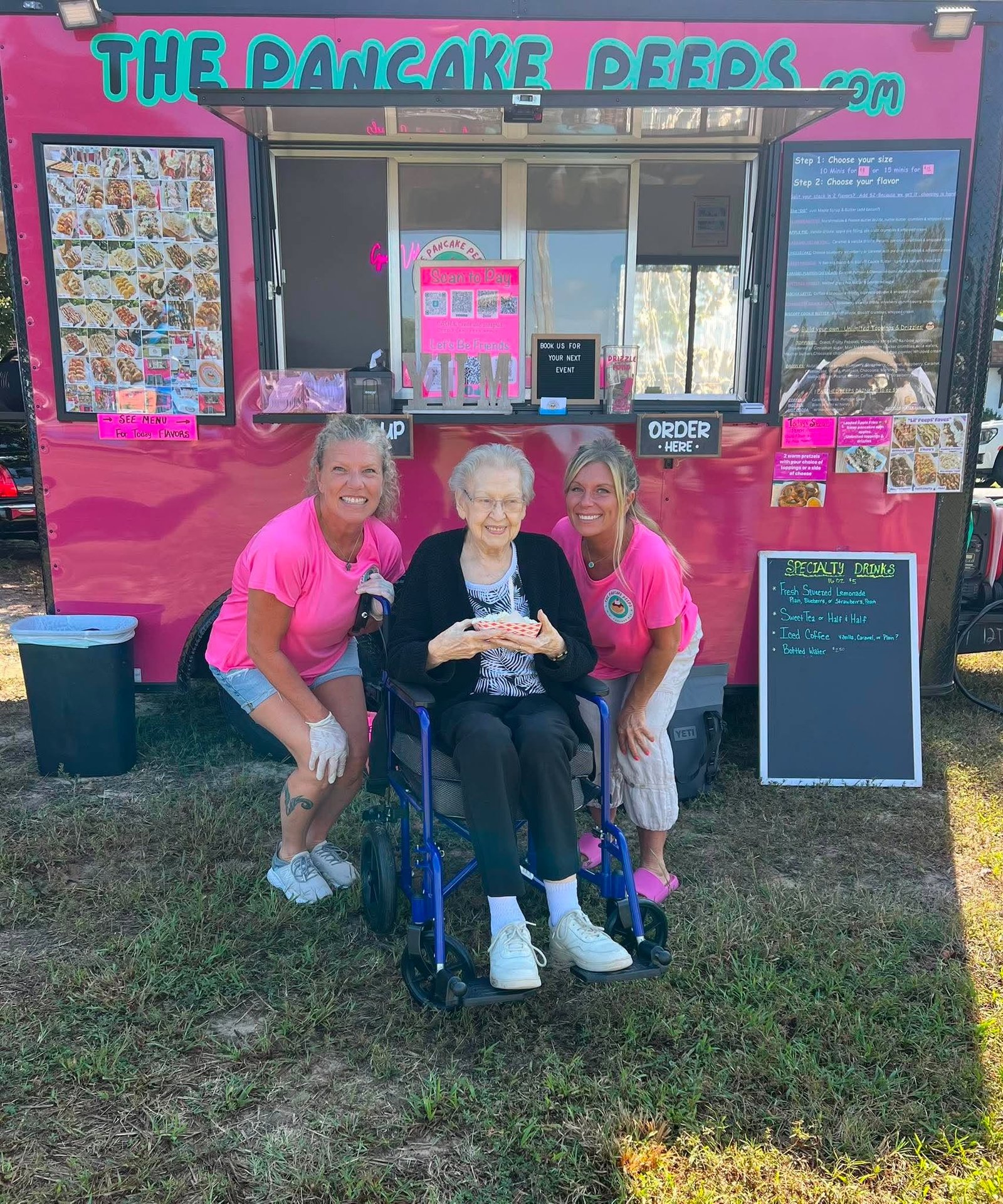 The Pancake Peeps owners with a community customer
