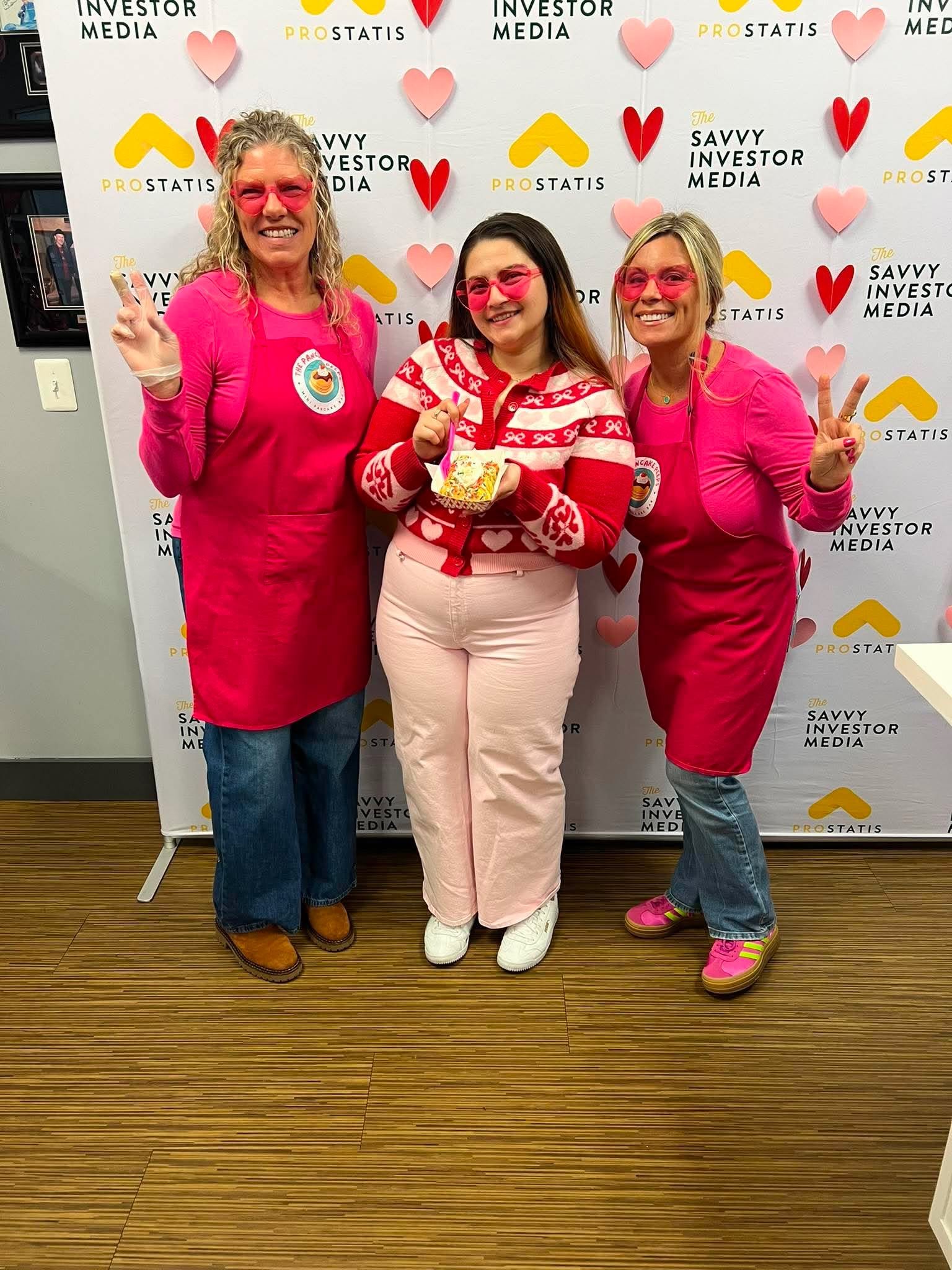 Lynda and Lauren serving mini pancakes at a corporate Valentine's event