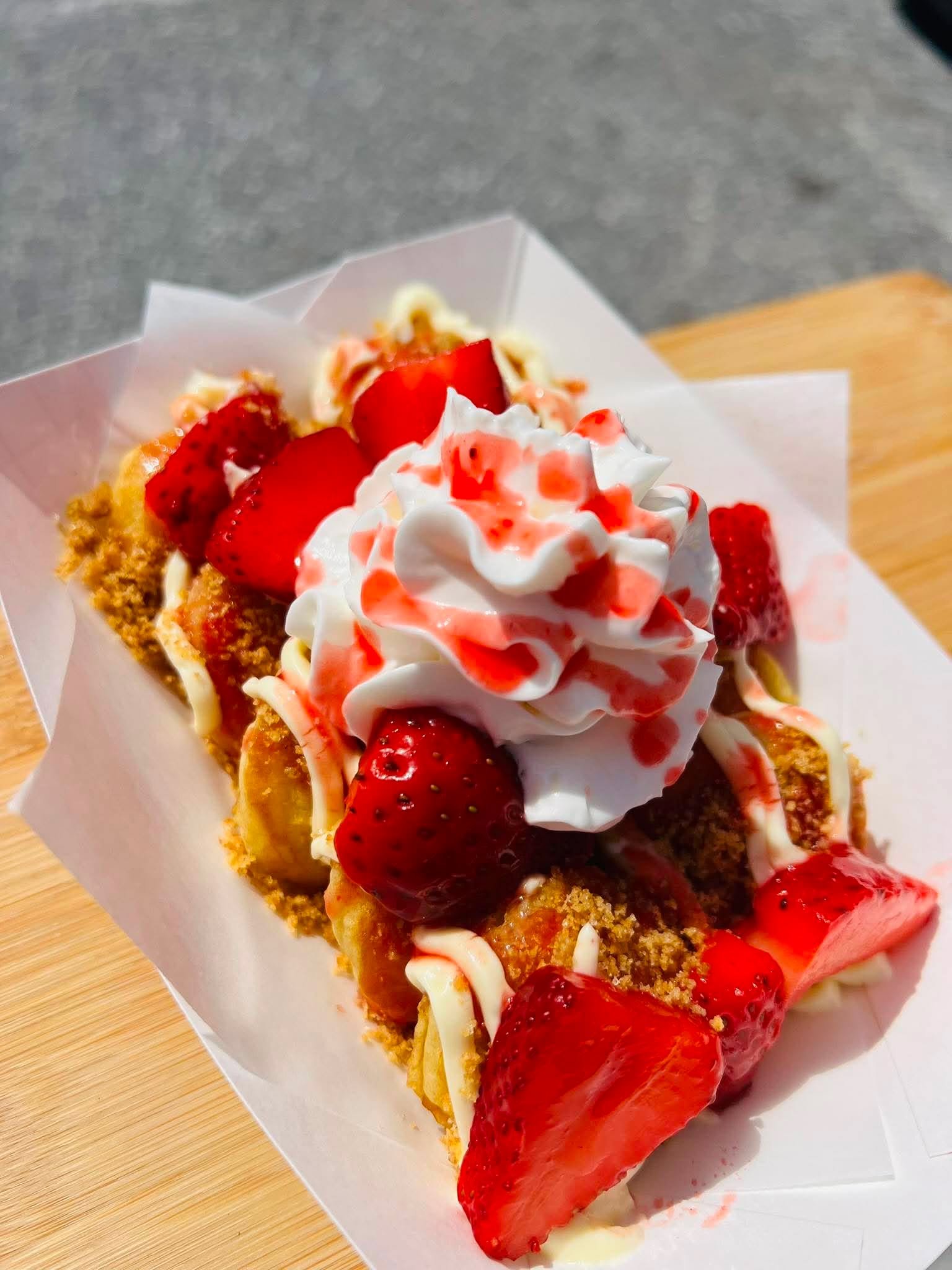 Strawberry cheesecake mini pancakes topped with whipped cream